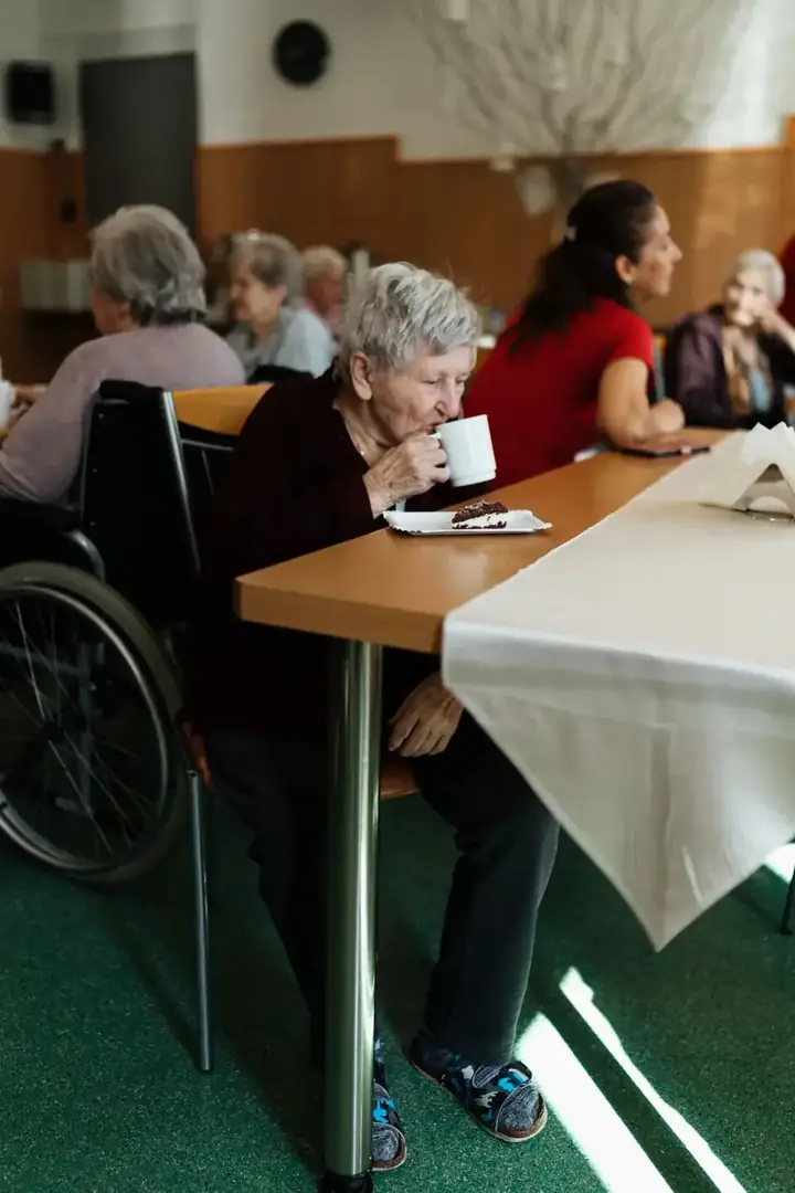 Members of the community gathered together over tea and cake