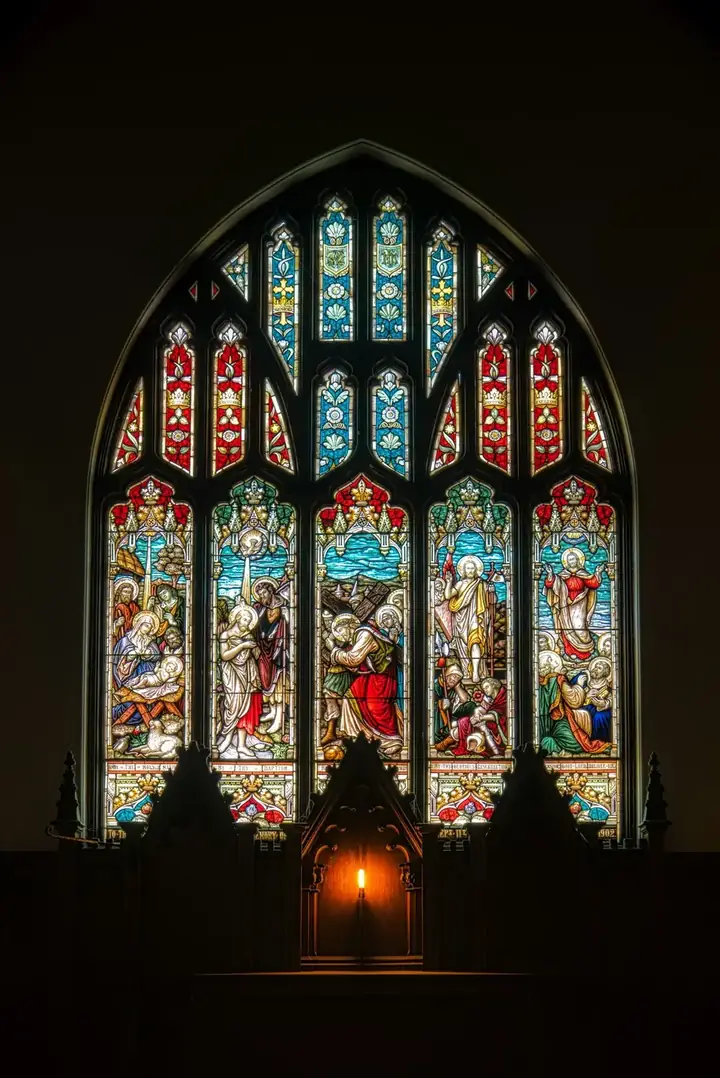 Stained glass glowing in the church window