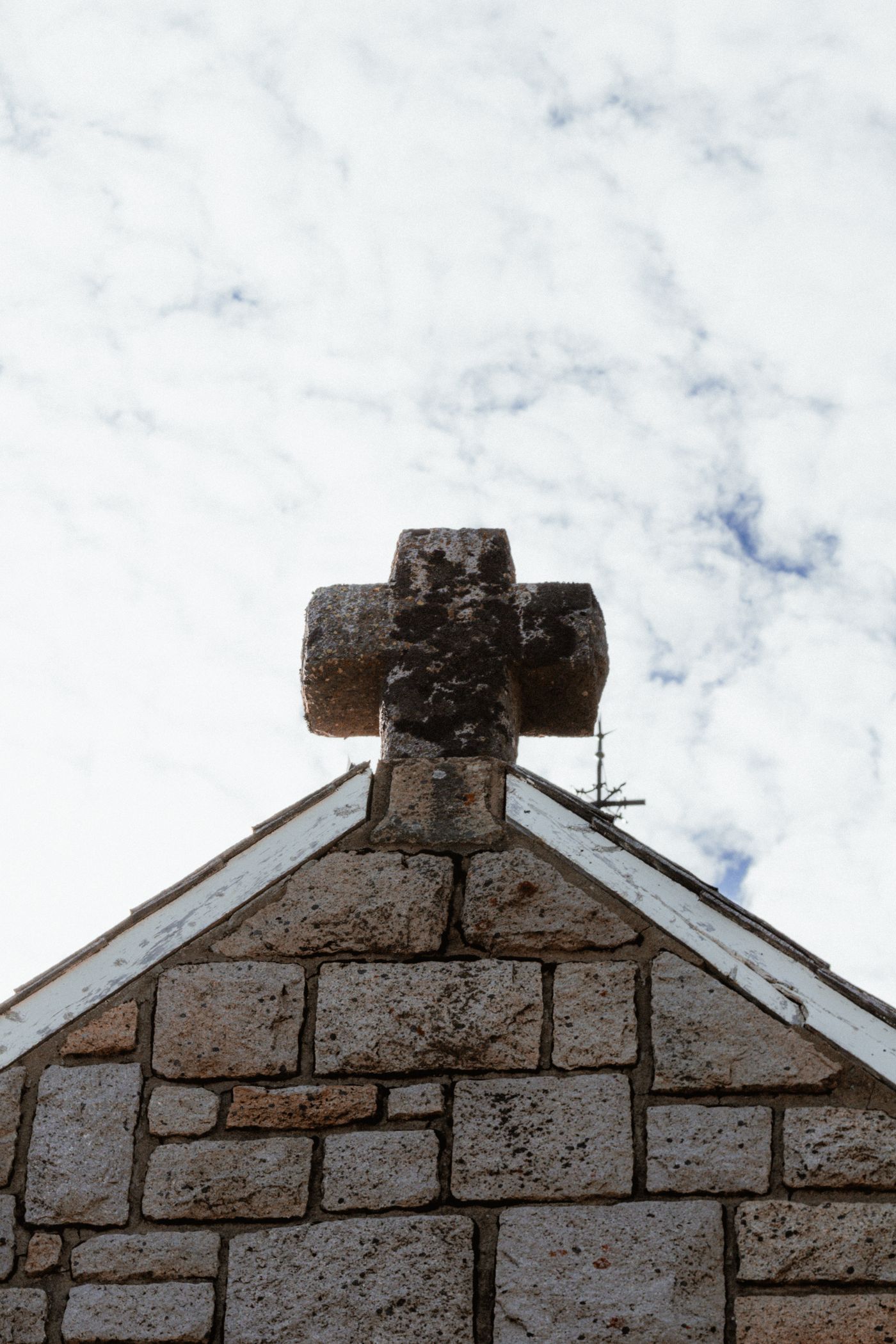 Stone church facade with cross